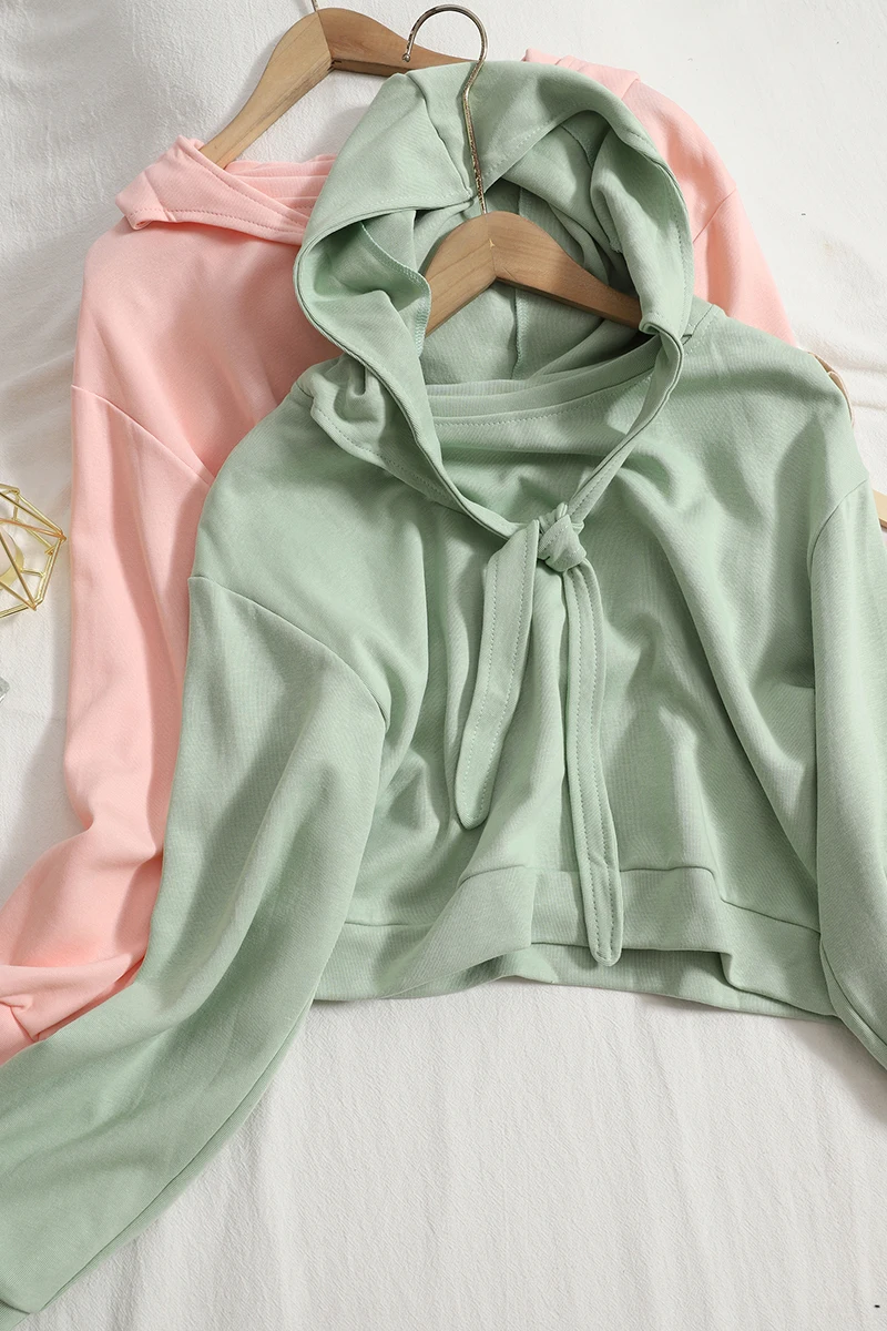 

Autumn new hedging all-match age-reducing lace-up hooded sweater solid color Korean version was thin loose crop top students