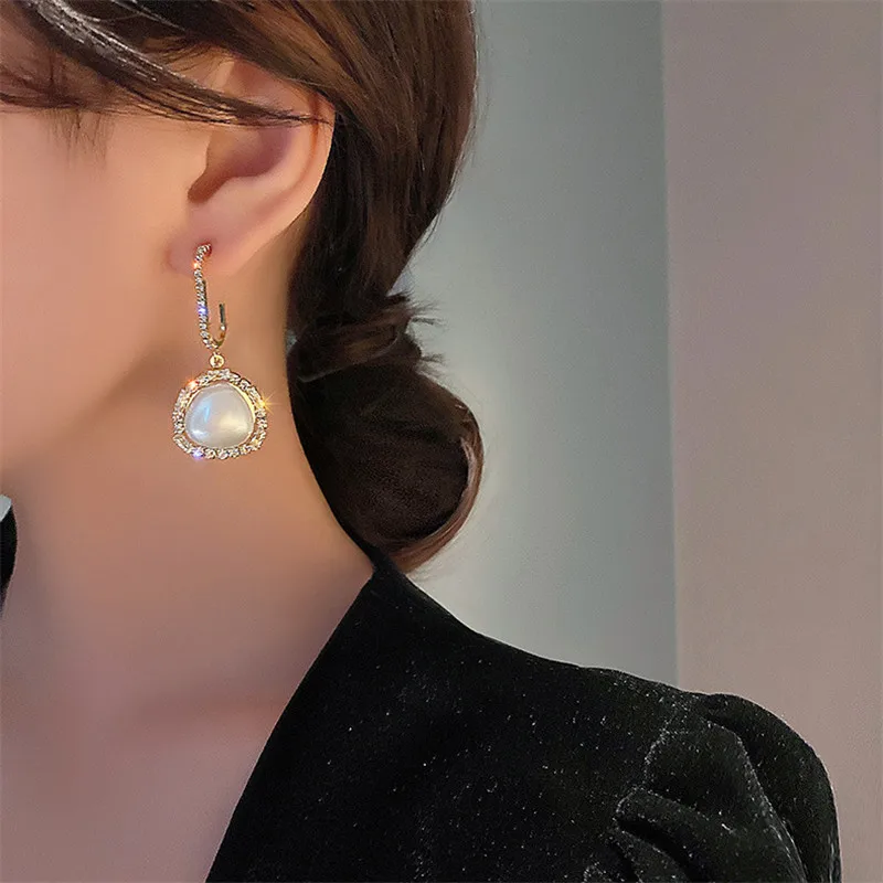 

Pearl earrings 2021 new fashion flash arc Korean temperament web celebrity 925 silver needle earrings