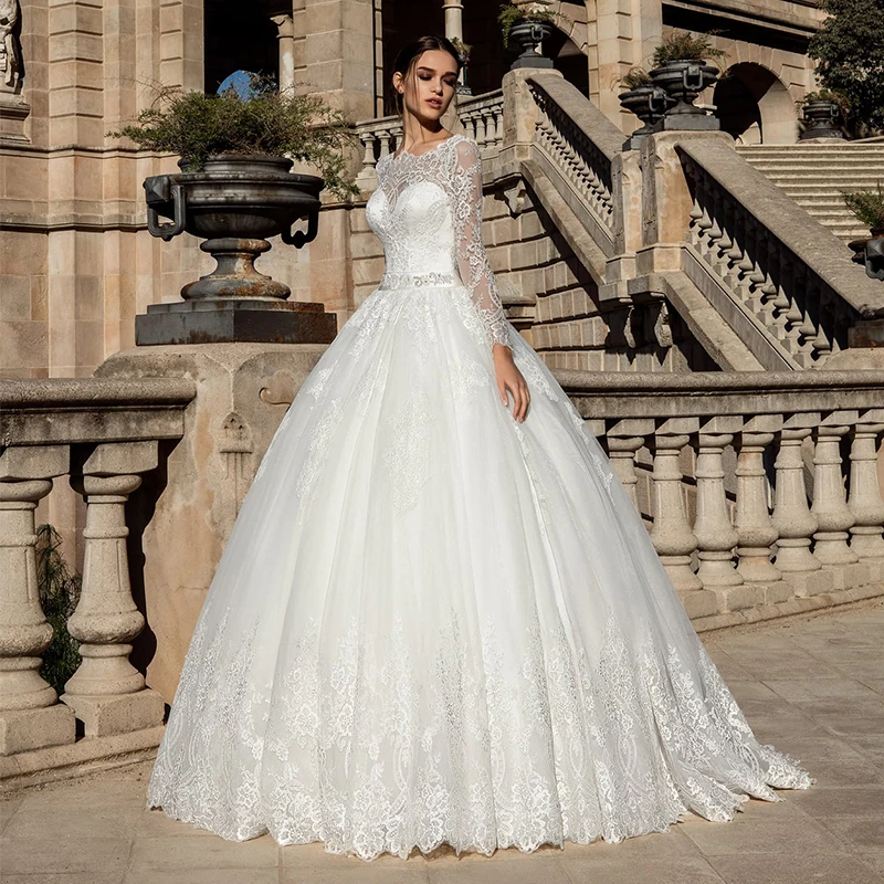 

Luxury Wedding Dresses Long Sleeve O Neck Lace Applique Charming Gowns Bow Sexy Backless Hand-Beaded Court Train Robe de mariée