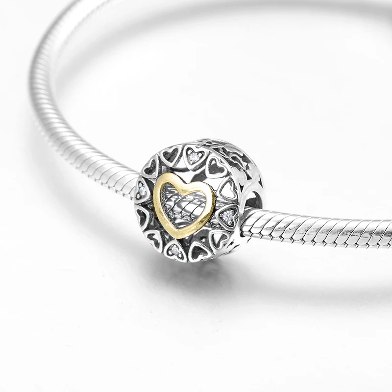 Золотые ажурные бусины в форме сердца из чистого серебра с кубическим цирконием