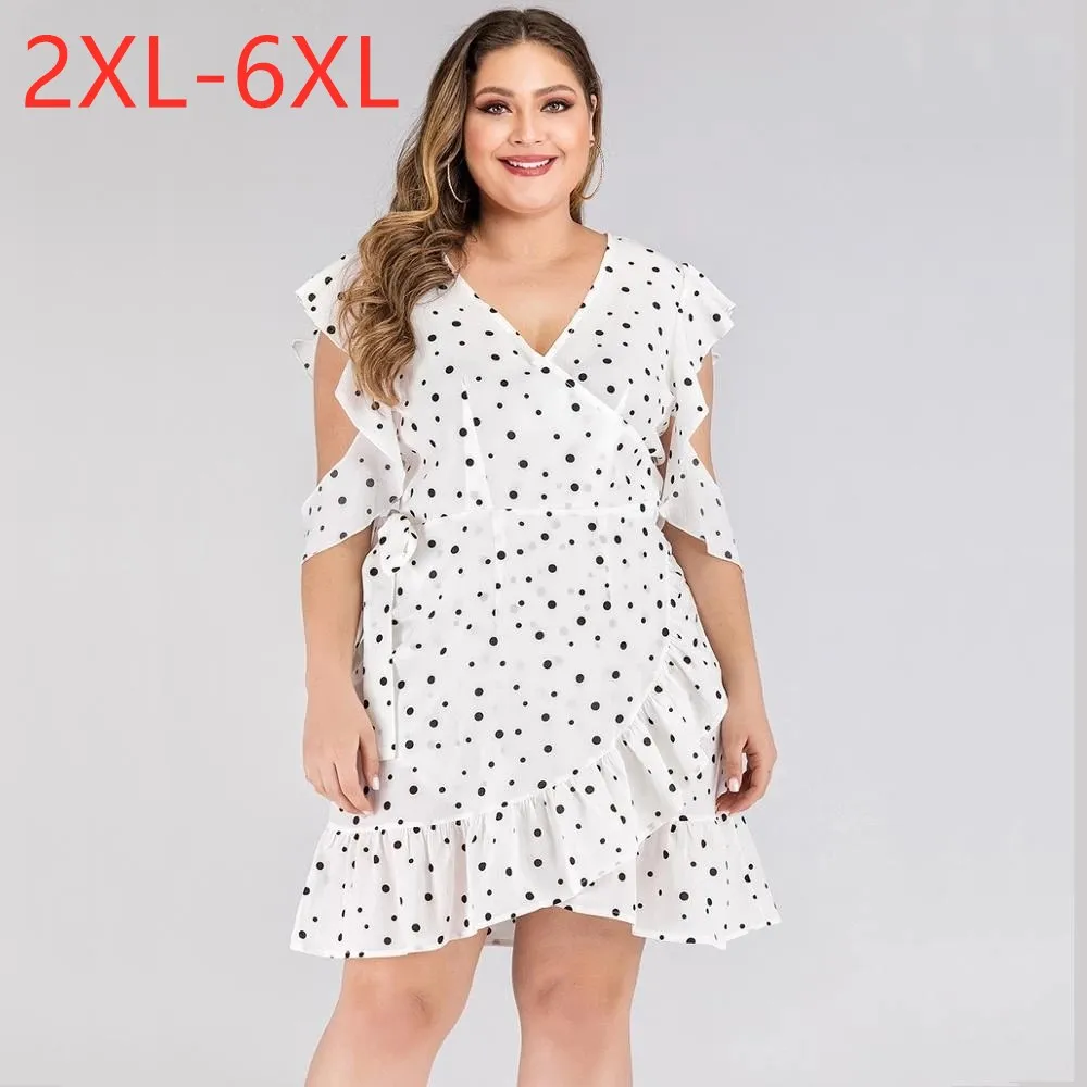 Женское платье в горошек с V-образным вырезом без рукавов |