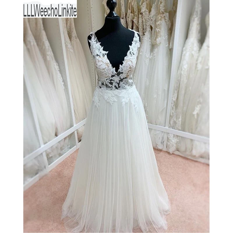 

Ivory A-Line Wedding Dresses Chapel Train Floor-Length Sleeveless V-Neck Backless Bridal Gowns Custom Made