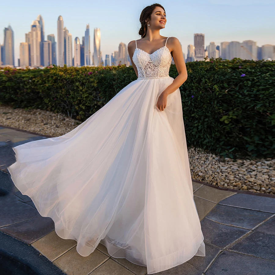 

Beach Romantic Wedding Dresses Sweetheart Spaghetti Straps Lace Applique Backless Sweep Train Bridal Gowns Sleeveless A-line New