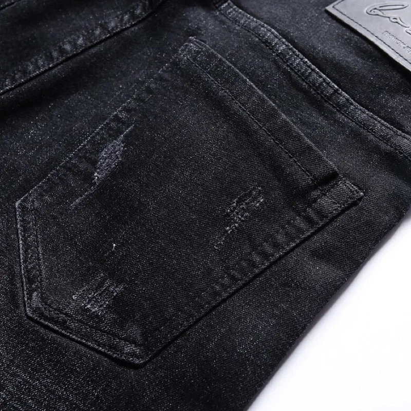 

bags pp original embroidery skull logo European version leisure slim elastic straight leg leather hole jeans fashion men's pants