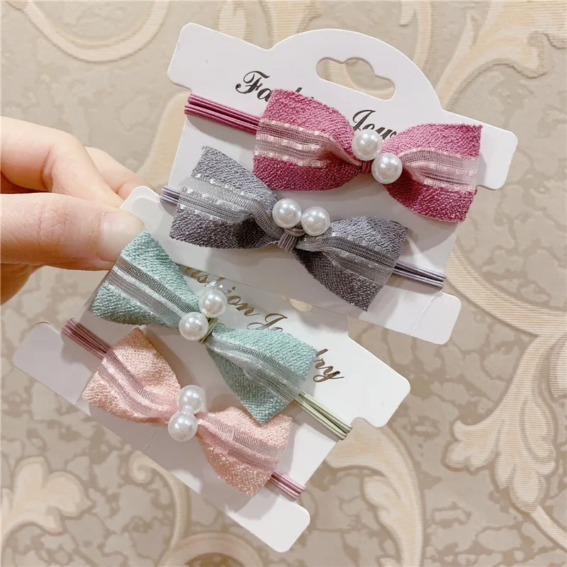 

Bowknot Decoration Women's Rubber Band Simple Fashion Trend Temperament Commuting Ponytail Pearl Hair Accessories 2021 New