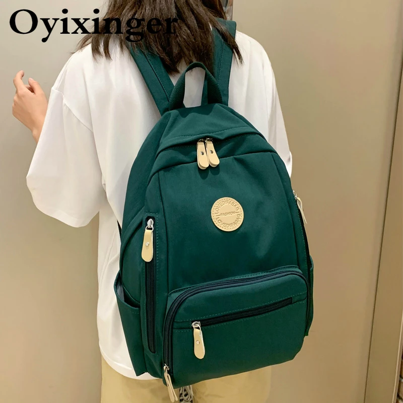 

OYIXINGER Waterproof Nylon School Bag Women 2021 New College School Backpack For Teenage Girls Leisure Multi-pocket Travel Bags