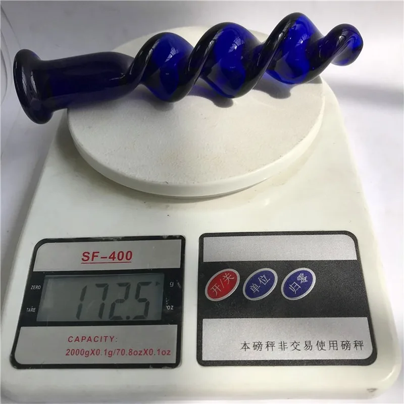 Стеклянный фаллоимитатор в форме спирали насыщенного синего цвета прозрачная