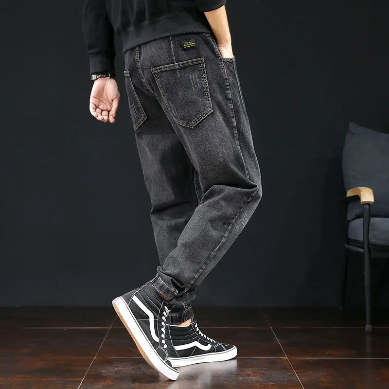 

Autumn and winter plus velvet thick size fat guy jeans men Korean trend elastic waist pants loose casual toe Harlem pants