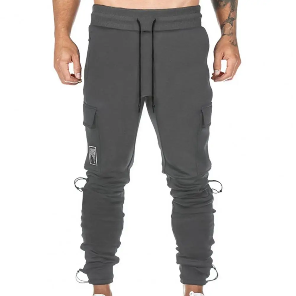 

Men Multi Pockets Deep Crotch Elastic Waist Trousers Ankle Tied High Waist Men Casual Cargo Pants Training Slacks Gyms Jogger