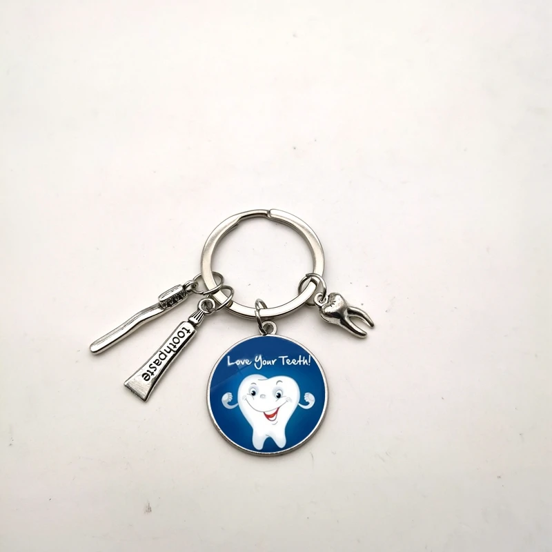 

New retro children's cartoon tooth keychain glass dome pendant dentist gift for men and women with the same paragraph2021
