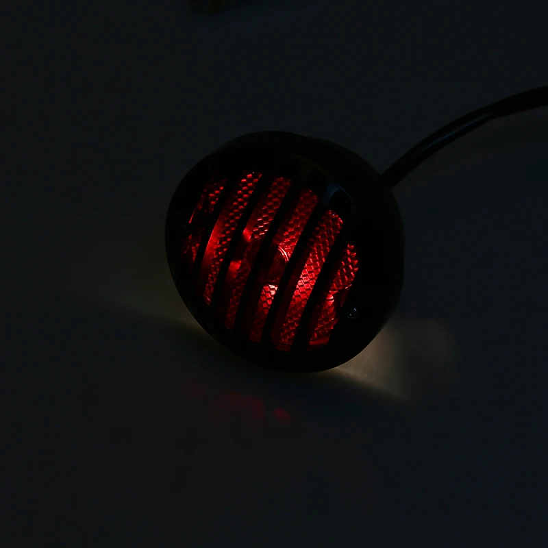 

POSSBAY Motorcycle Brake Tail Light Black Grilles Round License Plate Lamp Red Integrated Light 12V for Harley Bobber Chopper