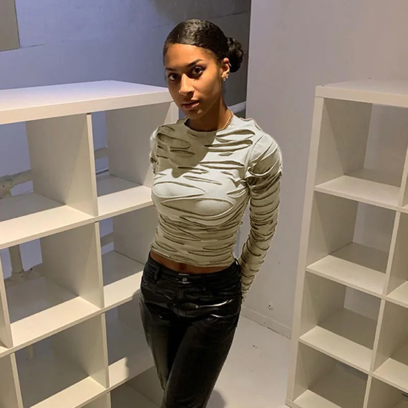 

Tattered hole texture round neck long-sleeved shirt women 2021 European and American fashion personality short T-shirt