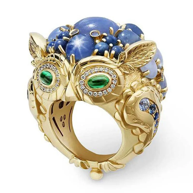 Кольцо с синим камнем в форме листьев лозы золотого цвета Z3M410|Кольца| |