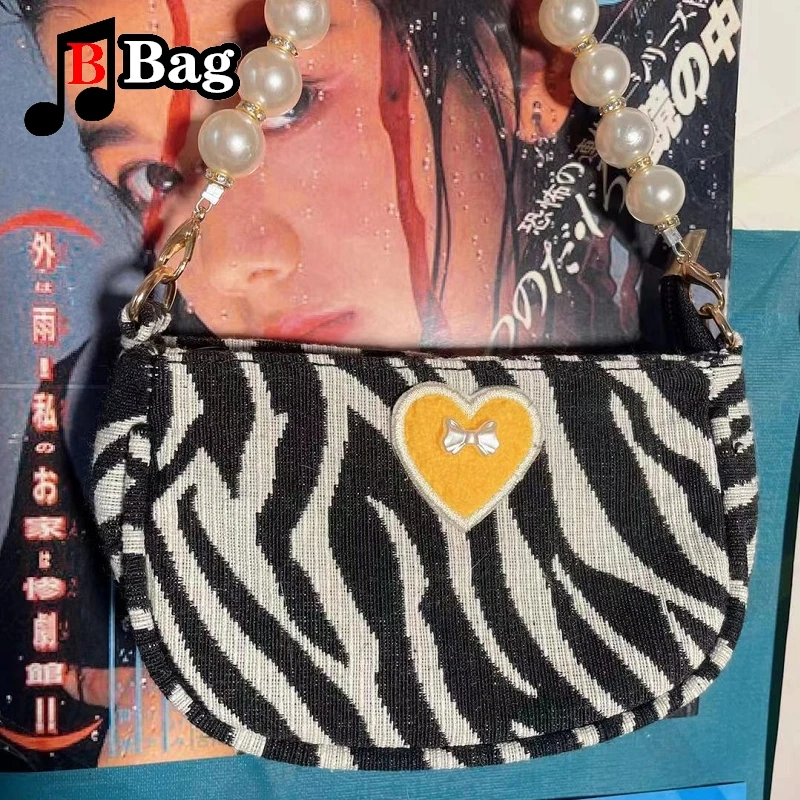 Женская мини-сумка через плечо с принтом зебры и бантом жемчужной цепочкой |