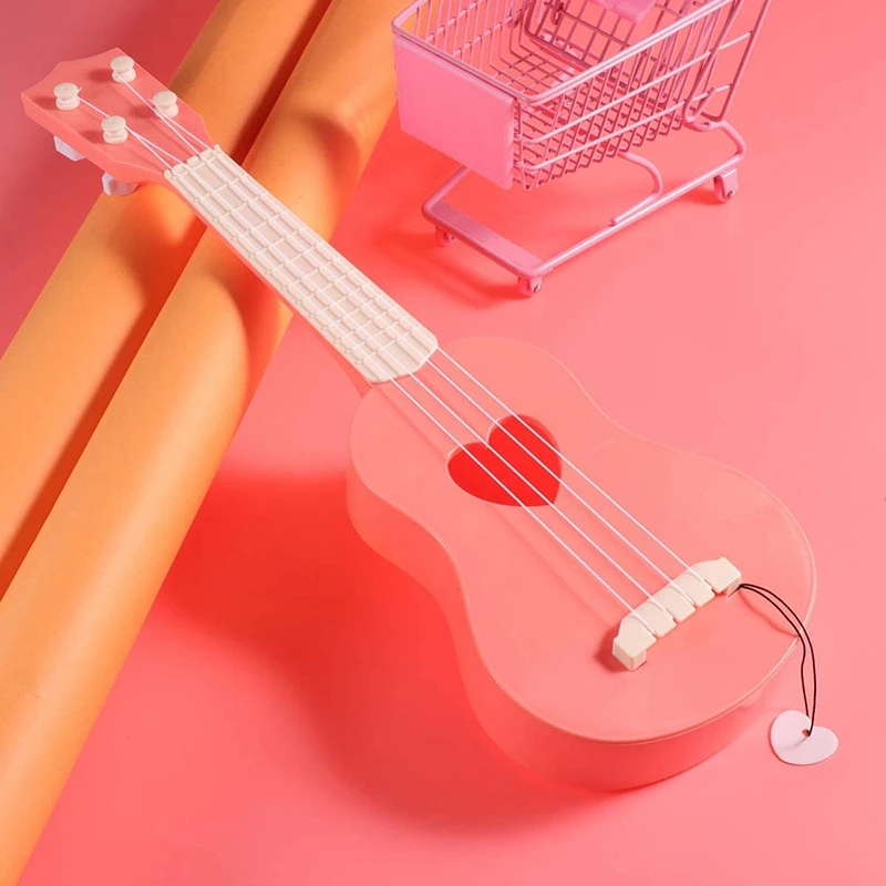 

Mini Guitar Ukulele Toy Musical Instruments Learning Guitar Toys for Children Can Attract Kids Attention (Pink)