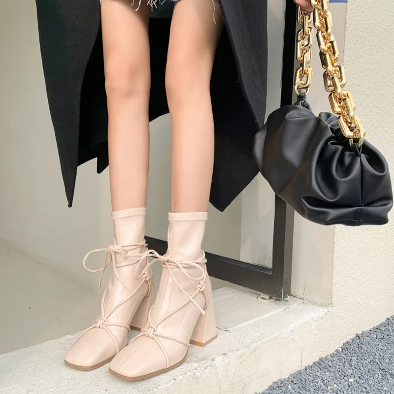 

Ochanmeb New Chic Cross Strap Tied Knot Boots Women Shiny Stretch Patent Leather Ankle Boots Black Beige Winter Warm Fleece Shoe