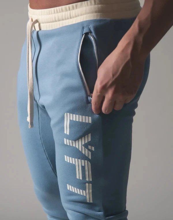Męskie spodnie dresowe Fitness kulturystyka męskie spodnie na co dziń z nadrukiem mężczyźni spodnie joggery bawełniane spodnie dresowe Slim w stylu Fit Streetwear męskie spodnie
