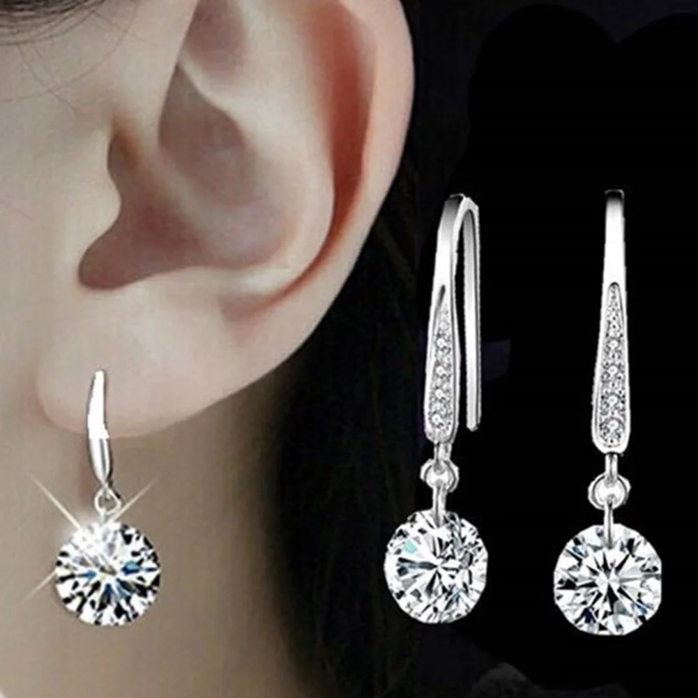 

Женские серьги-подвески с фианитами, серебряного цвета