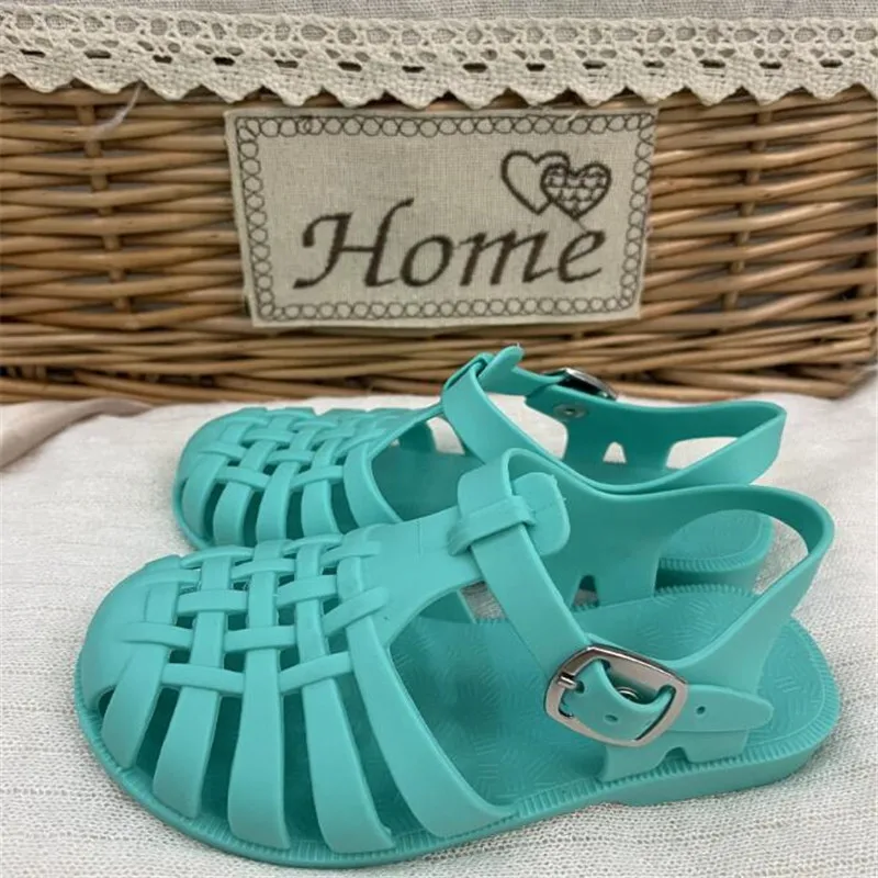 

Summer new fashion solid color buckle hollow out boys and girls sandals flat bottom soft bottom casual wear