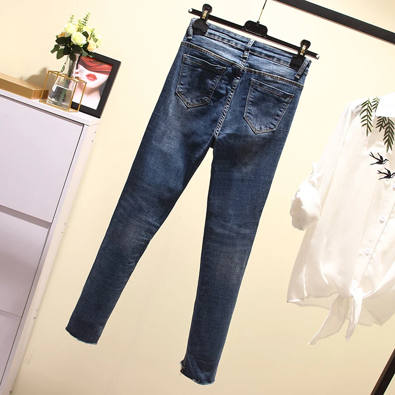 Джинсы с высокой талией обтягивающие большие размеры на молнии отворотом по