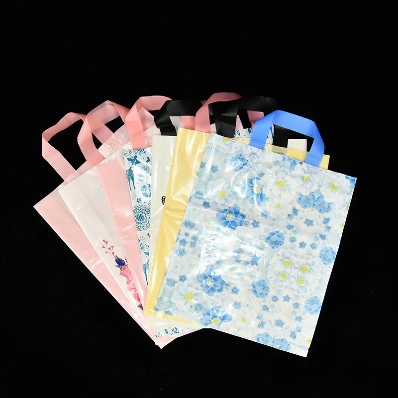 

50PCS / LOT Multiple Sizes Plastic Shopping Bags Handles Clothes Tote Bags Plastic Wholesale Shopping Hand Packet