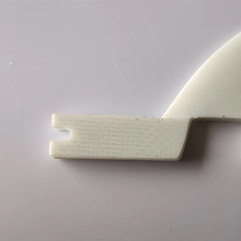 

Solid white color surfboard middle fins