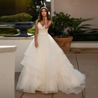 Современное простое ТРАПЕЦИЕВИДНОЕ свадебное платье из органзы безрукавные Свадебные платья для невесты с глубоким V-образным вырезом, с перекрещивающимися бусинами на спине