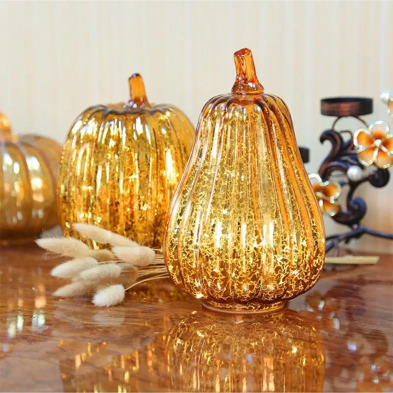 

The mercury glass pumpkin lamp is light orange, 5.5 inches. Creative glass luminous multi-style small pumpkin led light