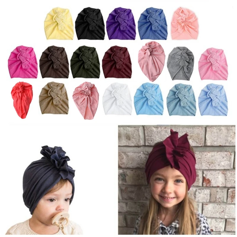 

Шапка-бини однотонная демисезонная с большим бантом для новорожденных девочек