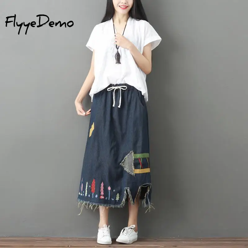 Женская джинсовая юбка до середины икры большого размера с дырками и кисточками