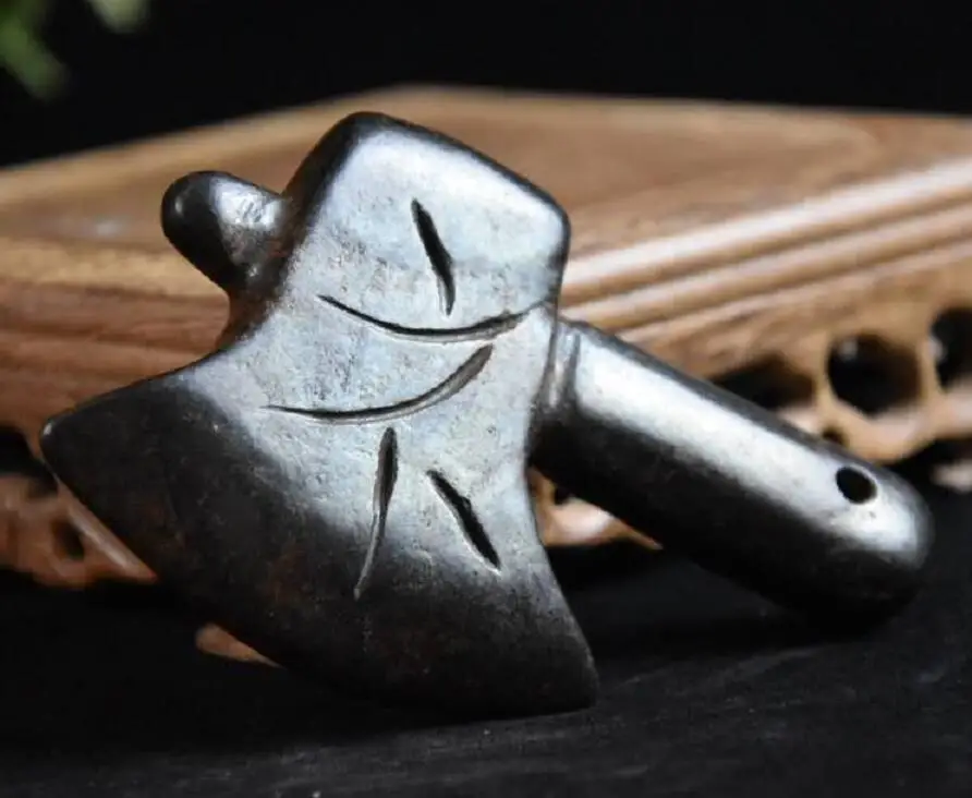 meteorite sculpture axe