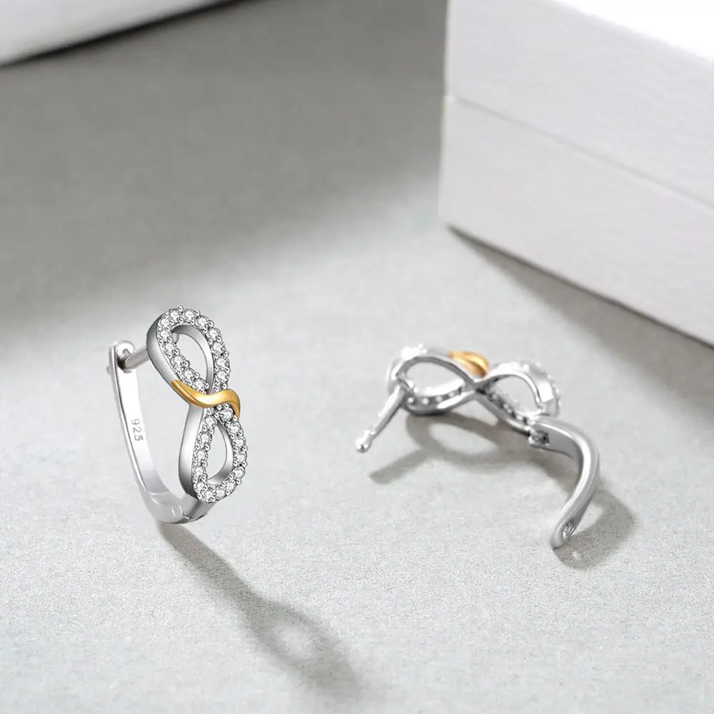 Серьги-гвоздики в виде знака бесконечности серебряные украшенные золотым