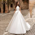 Платье свадебное атласное с глубоким круглым вырезом и карманами