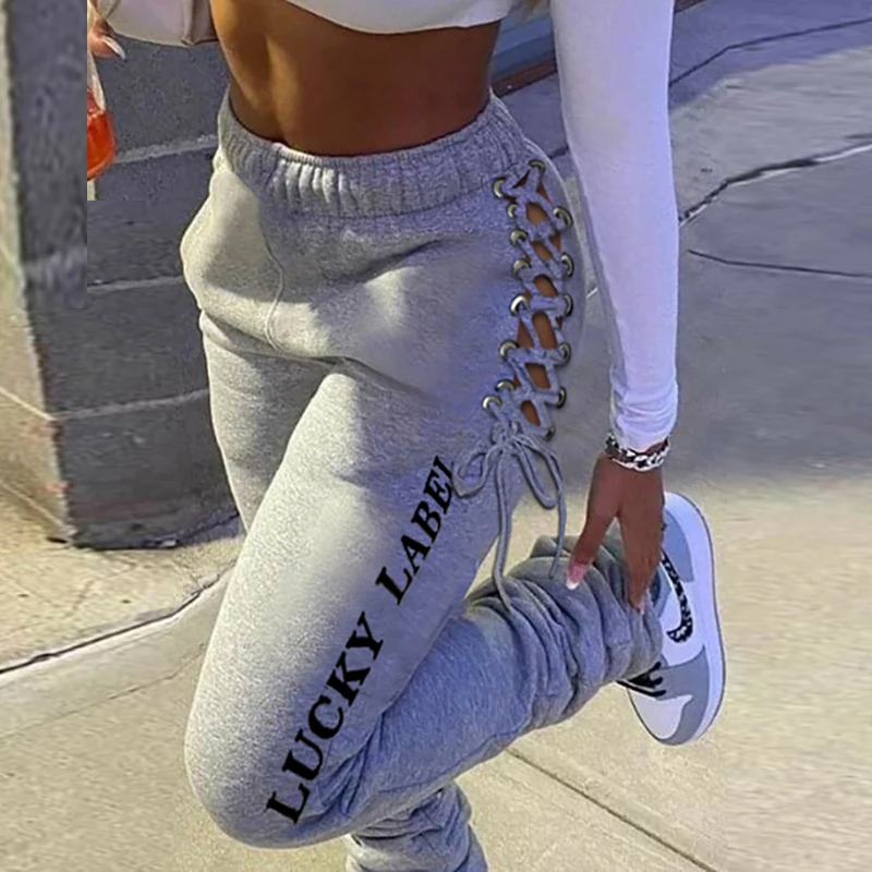 

Сексуальные женские брюки с вырезами, повседневные брюки с принтом букв, эластичная талия, осенние женские спортивные длинные брюки с высок...