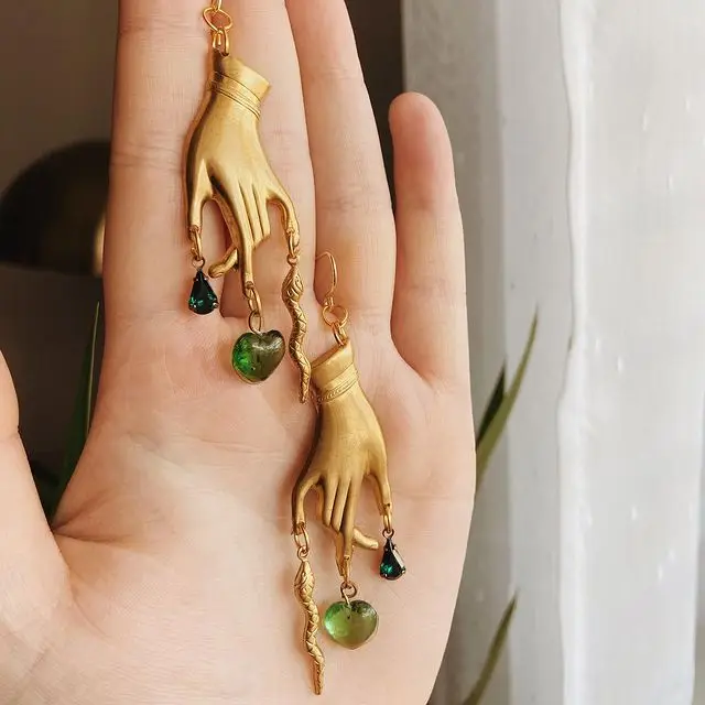 

Serpent Snake Earrings with Green Heart