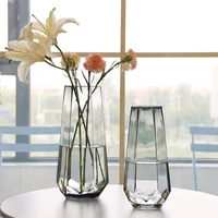 simple glass vase in northern europe home furnishing decoration six edged vase with flowers on dining table