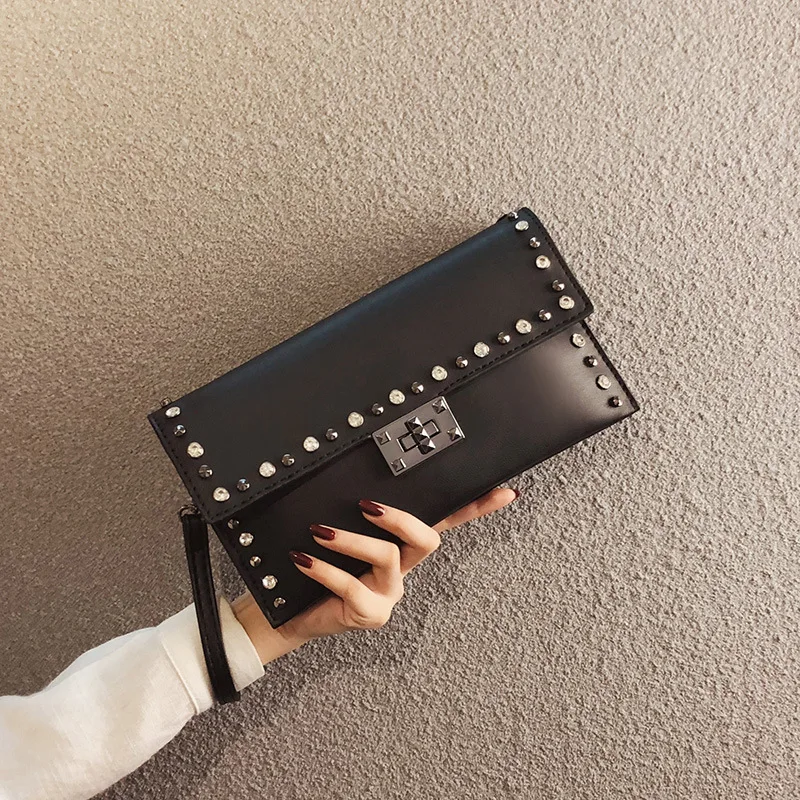 

new handbag girl lap rivets envelope bag single shoulder oblique span bag one piece new style handbag envelope bag span bag.