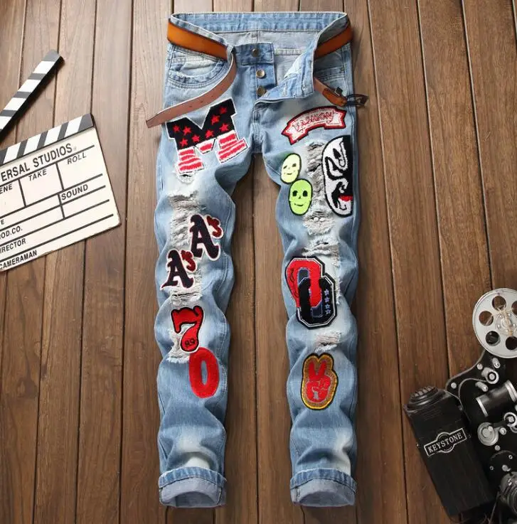 Men's slim jeans homme embroidered multi-badge ripped holes blue Original design autumn and winter new style Europe and America