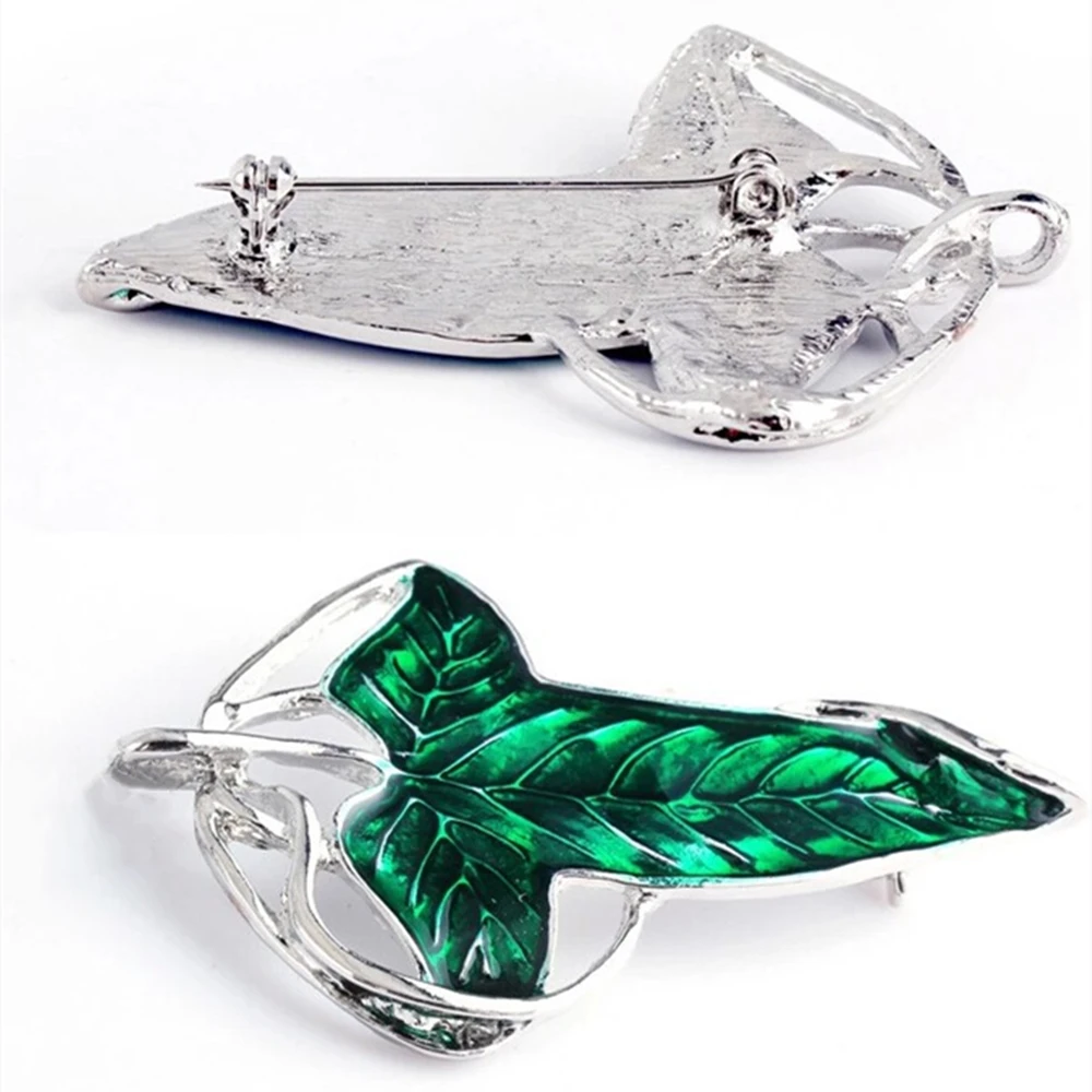 Эльфийская брошь в виде зеленых листьев лориенов с толкиевым гальадриэлем
