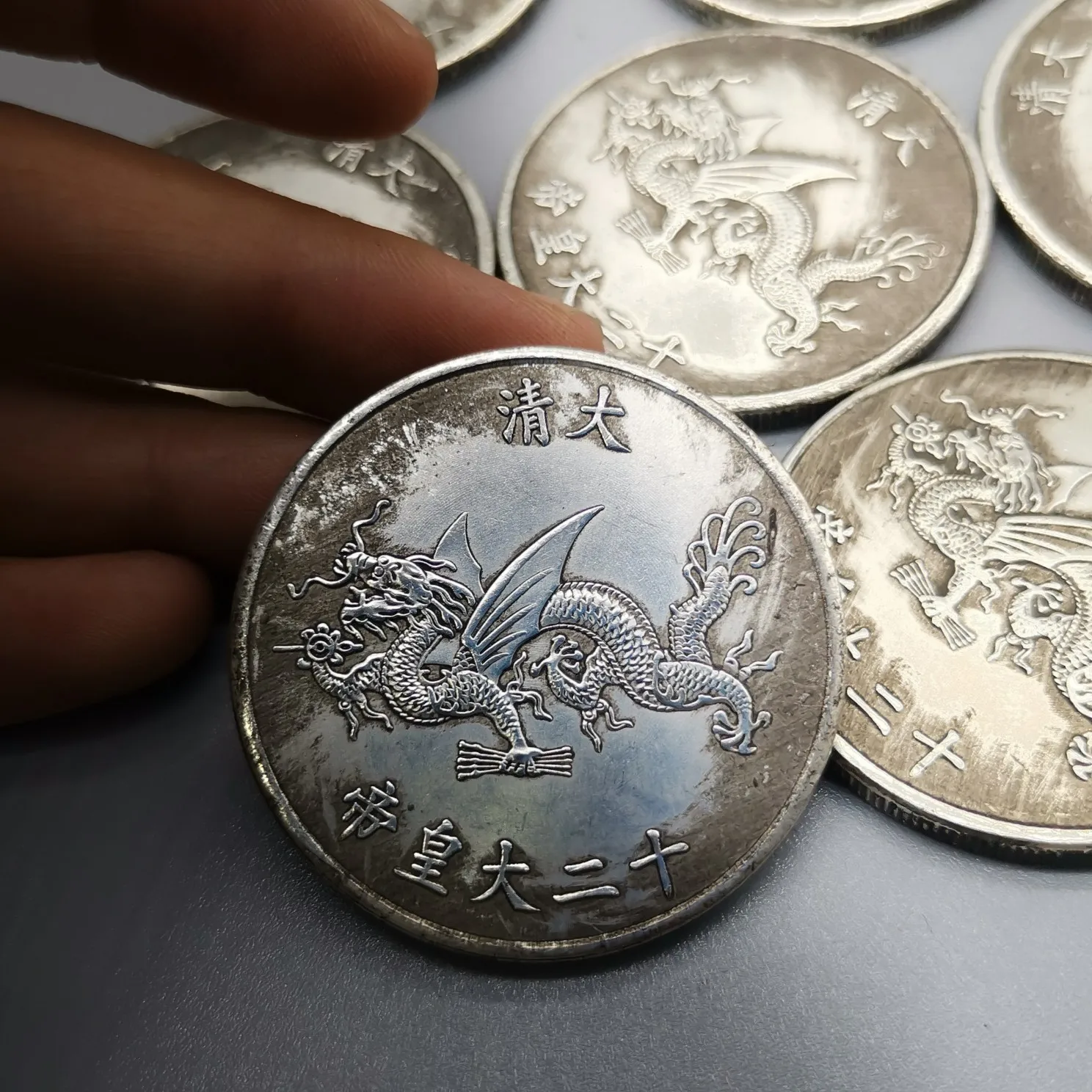 Монета 12 5 рублей. Монеты империи Цин.