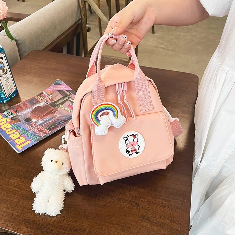 

Сумка-рюкзак женская с кольцевой пряжкой, модный портативный ранец для девочек-подростков, маленькая школьная сумка с значком, женский рюкз...