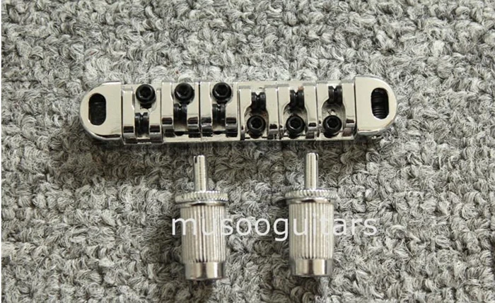 

Tun-O-Matic 6 String Roller Saddle Guitar Bridge Made in China - Chrome