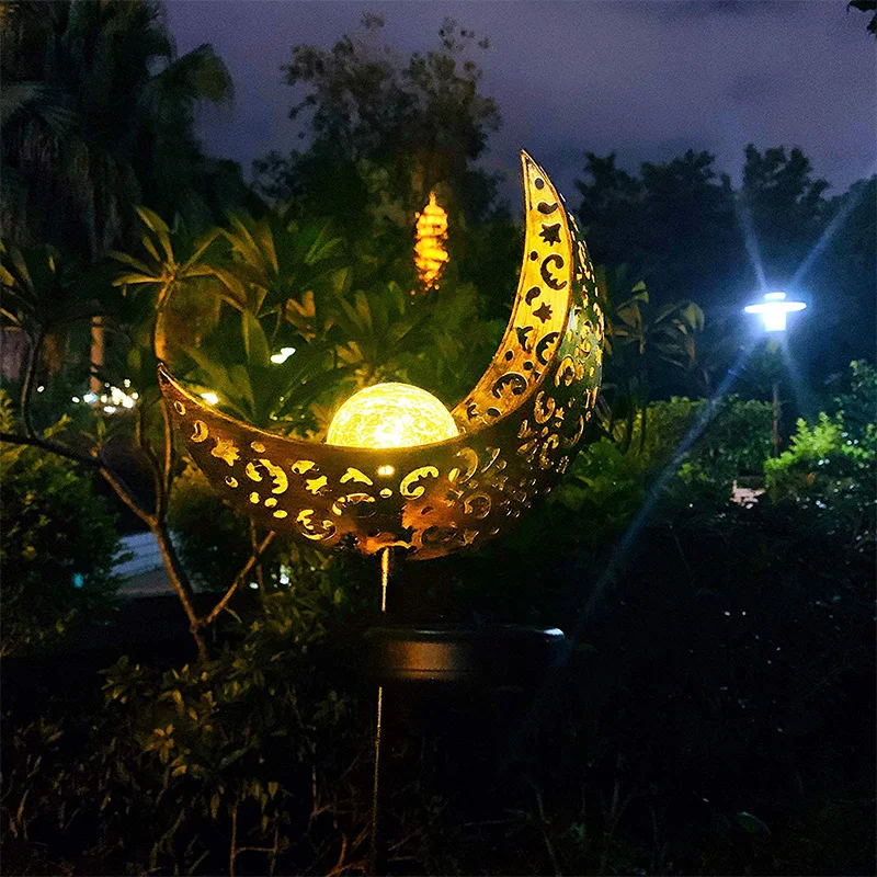 

Newest Solar Powered Garden Lights, 2 Pack Antique Brass Hollow-Carved Metal Moon with Warm White Crackle Glass Globe Stake Ligh