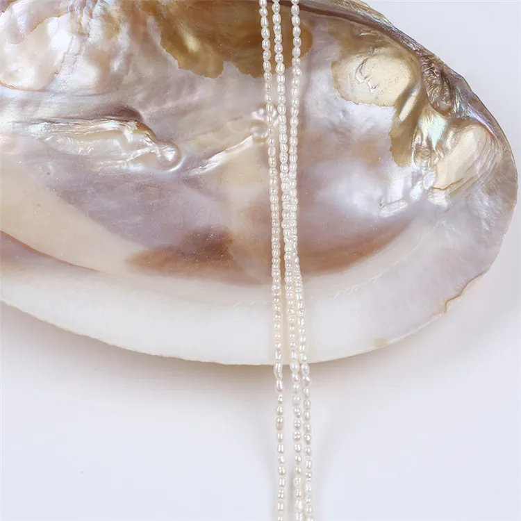 

Hot Selling Rice Drop Shape 2-2.5mm Freshwater Pearl strands
