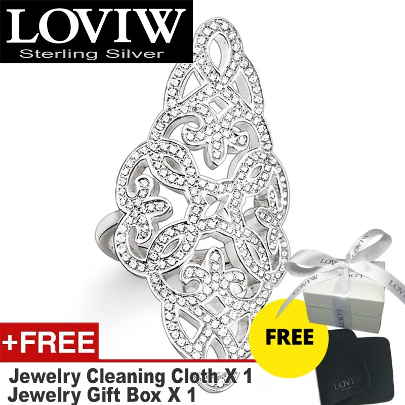 Коктейльное кольцо с белым кубическим орнаментом стильные свадебные комплекты