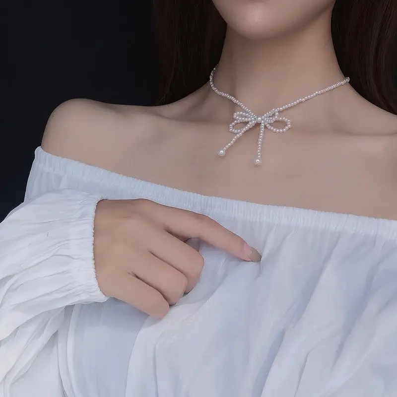 

Elegant White Imitation Pearl Choker Necklace Sweet Butterfly Bowknot Pearl Wedding Necklace for Women Charm Fashion Jewelry