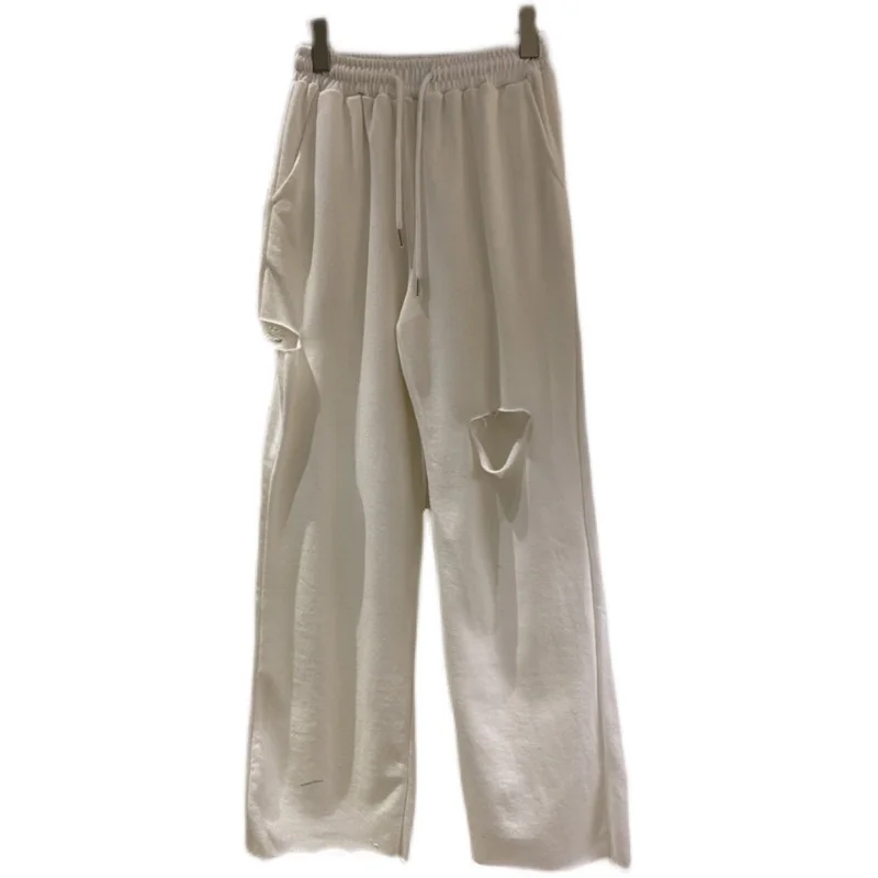 

2021 spring and summer women's new fashion all-match solid color lace-up high-waist hole frayed casual pants