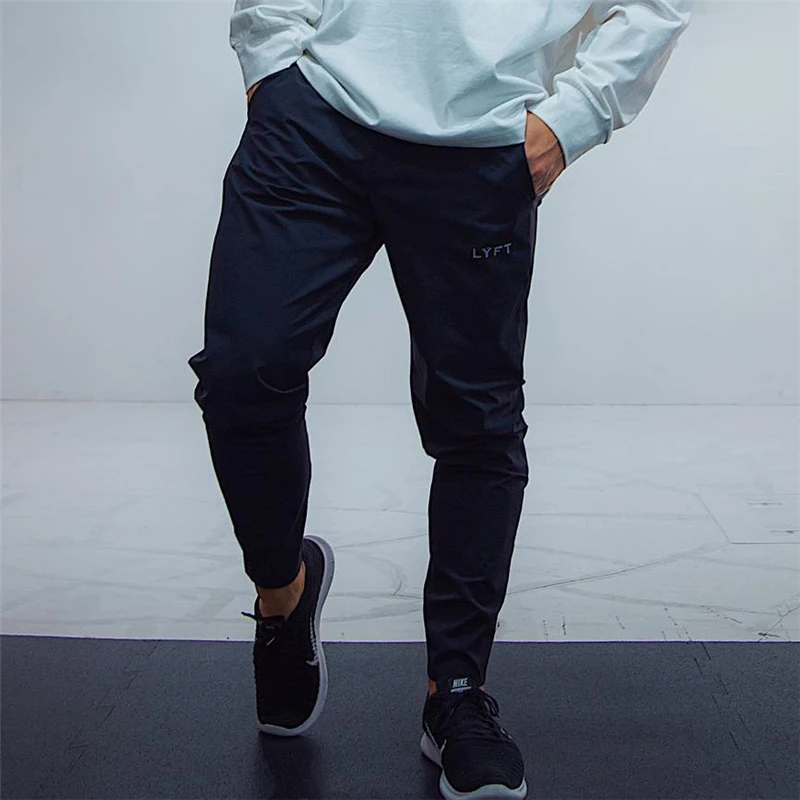 

2021 LYFT Quick Drying Joggers Sweatpants Men Slim Casual Pants Male Gym Fitness Workout Trackpants Sport Track Pants