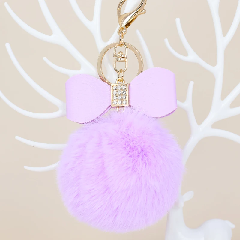 

Pompom cute children's gift keychain pendant Rhinestone inlaid PU bowknot hairball keychain Ladies bag keychain accessories
