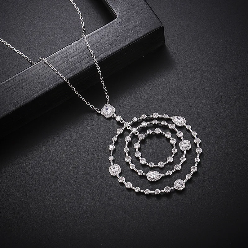 

European and American foreign trade copper micro-inlaid zircon high-end hollow necklace round real gold plating pendant cross-bo